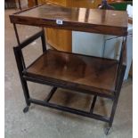 A 32 1/2" mid 20th Century polished oak metamorphic two tier tea trolley/serving table