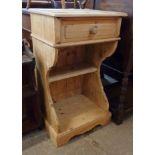 An 18" stripped pine stand with frieze drawer, shaped standard ends, shelf and undertier