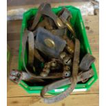 A box of heavy horse tack including three bridles, sleigh bells, etc. - well worn condition