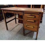A 3' 6" vintage bracketed oak Abbess single pedestal office desk, model D107 with fitted slide,
