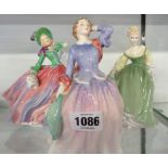 Three Royal Doulton figures comprising Autumn Breezes HN 1934, Blithe Morning HN 2065, and Fair Lady