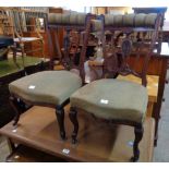 A pair of Edwardian walnut framed boudoir chairs with upholstered top rails and decorative splat