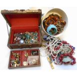 A box containing a quantity of costume jewellery including necklaces, chains, rings, etc.
