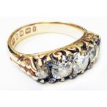 An early 20th Century 18ct. gold ring set with old and cushion cut diamonds