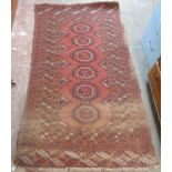 A wool Bokhara rug with central row of six guls within multi borders and top and bottom borders,