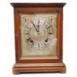 A mahogany and bevelled glass cased library clock, the silvered dial with chime/silent and regulator