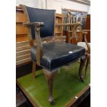 An early 20th Century stained wood framed and rexine upholstered office elbow chair, set on cabriole