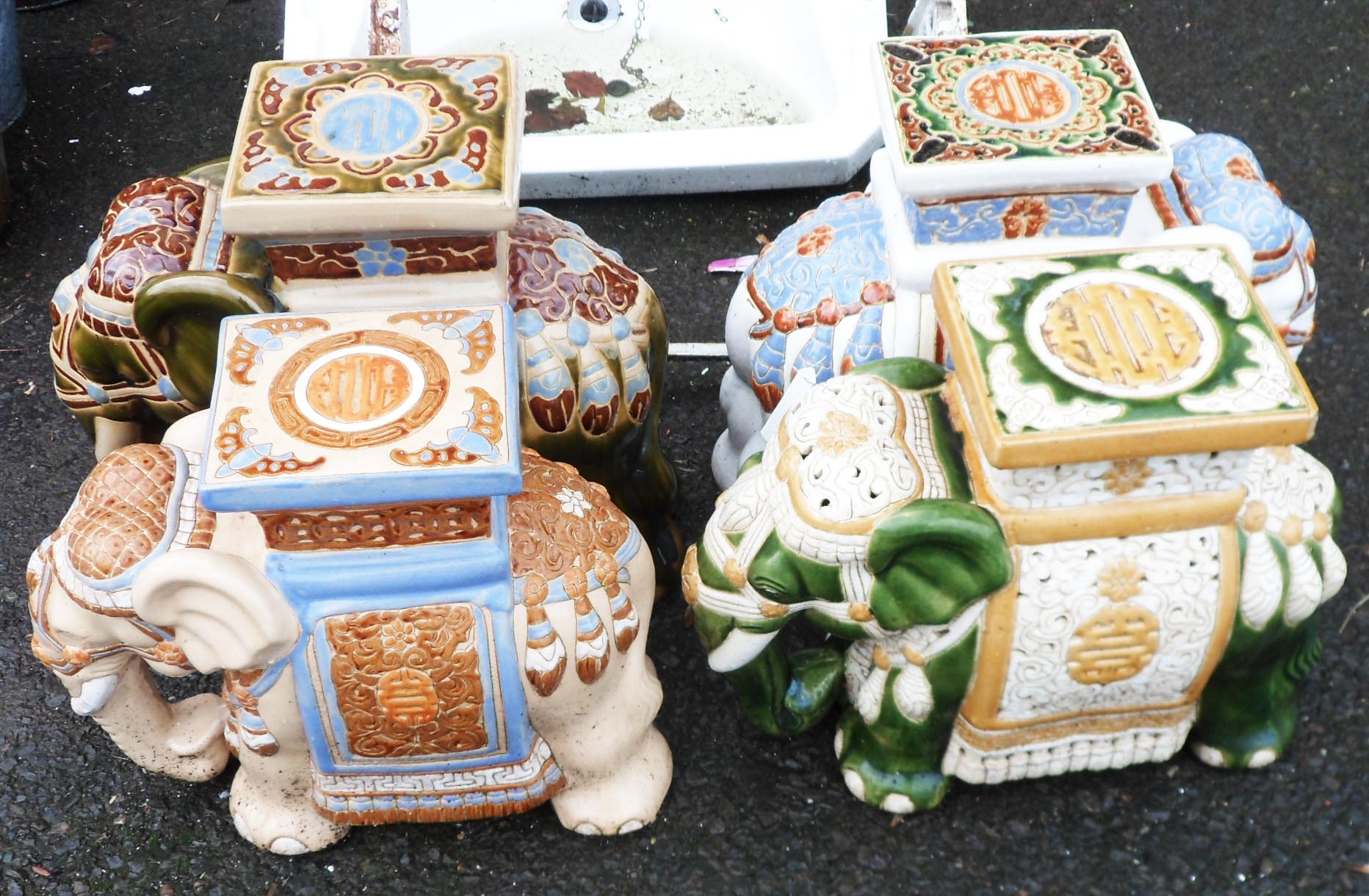 Four large ceramic elephant pattern garden stools