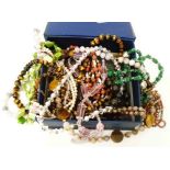 A collection of good quality costume jewellery necklaces including tiger's-eye, nephrite jade and