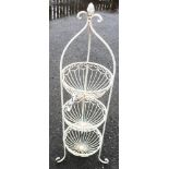 A decorative painted wire work three tier garden basket stand