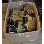A box containing assorted mantel clock movements