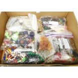 A box containing a large quantity of loose jewellery beads, etc.
