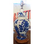 A temple jar style blue and white table lamp