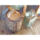 A stoneware jar in wicker carrier for James Hawker & Co., Wine Merchants of Plymouth and a modern