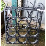 A wrought iron and horseshoe twelve bottle wine rack