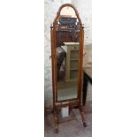 An early 20th Century walnut framed cheval mirror in the Queen Anne style, with shaped plate and