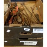 A quantity of vintage chisels, a sharpening stone, brace bits, etc.