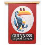 A vintage enamelled double sided advertising sign "Guinness is Good for You" depicting the toucan