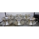 A set of six Dutch silver plated soup cups and saucers
