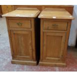 A pair of Victorian waxed pine bedside pot cupboards, each with single drawer and cupboard under