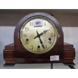 A mid 20th Century oak cased mantel clock with Enfield eight day chiming movement