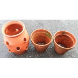 A terracotta strawberry pot - sold with two other garden pots