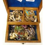 A concertina jewellery box containing mainly named costume jewellery including Trifari, Butler &