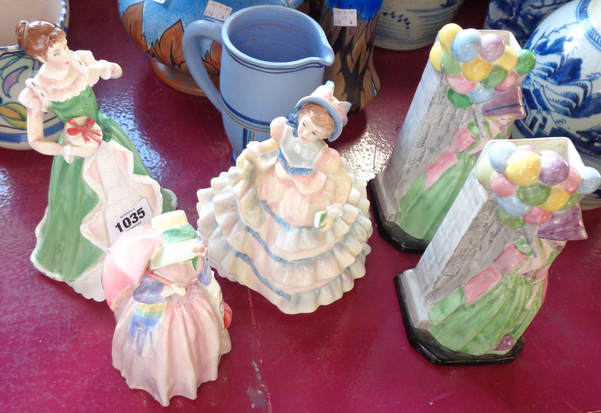 Three Royal Doulton figures comprising Miss Demure HN 1402 (cracked), Hannah HN 3369 and Merry