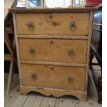 A 24 1/2" antique stripped pine chest of three long graduated drawers, set on bracket base
