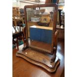 A Victorian mahogany platform dressing table mirror with oblong plate, scroll supports and