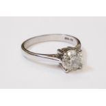 A hallmarked 750 white metal diamond solitaire ring - 1.02ct. - with diamond certificate