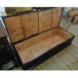 A 4' old ebonised pine lift-top blanket box with plinth base