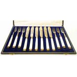 A cased set of six each silver fish knives and forks with capped mother-of-pearl handles