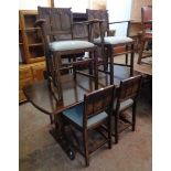 A 5' mid 20th Century dark stained elm Ercol refectory style dining table - sold with a set of six