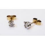 A pair of hallmarked 375 gold small diamond solitaire ear-rings - 0.2ct. TDW