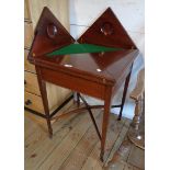 A 22" late Victorian polished mahogany envelope card table set on slender square tapered supports