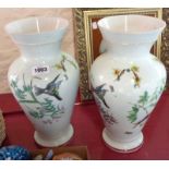 A pair of baluster vases with bird, flower and butterfly decoration