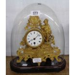 A 19th Century gilt spelter ornate figure decorated salon mantel timepiece with eight day