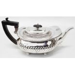 A silver teapot of semi reeded design - London 1894