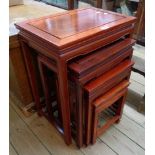 A nest of four 20th Century Chinese polished hardwood quartetto tea tables with moulded decoration