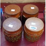 A set of four Hornsea Bronte storage jars with wooden lids