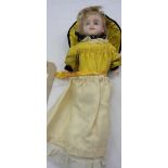 A Victorian doll with wax head, in original dress - height 13 1/2"