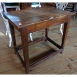 A 26" antique polished oak side table, set on an open stretcher base