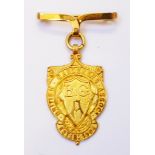 A boxed 18ct. gold award fob for the British Gardeners Association first examination 1911, on 9ct.