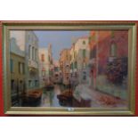 Raimondo Roberti: a gilt framed oil on canvas, depicting a Venetian canal with buildings - 23 1/2" X