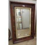 A 19th Century walnut and mixed wood framed bevelled oblong wall mirror with gilt slip