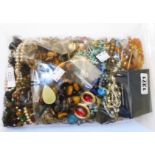 A bag containing a large quantity of assorted costume jewellery