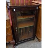 A 22" Victorian simulated rosewood music cabinet with two leather fronted shelves and partitions