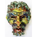 A majolica wall mask of a bearded man