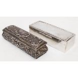 A silver oblong ring box with embossed decoration and hinged lid - Birmingham 1906 - sold with a